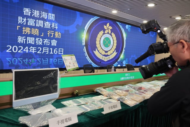 Customs displays the goods such as electronics which were seized during the city’s largest money laundering case. Photo: Dickson Lee