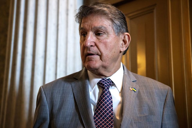 West Virginia Sen. Joe Manchin talks to reporters as he leaves the Senate floor following a vote on January 23, 2024.