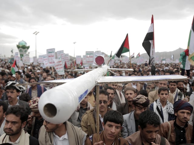 SANAA, YEMEN - FEBRUARY 16: Thousands of Houthi supporters, holding Yemen and Palestine flags, gather at the Sebin Square to stage a solidarity demonstration with Palestinians and protest against the Israeli attacks on Gaza Strip on February 16, 2024 in Yemen, Sanaa. Demonstrators, carrying banners, chanted slogans against the USA and Israel during the demonstration. (Photo by Mohammed Hamoud/Anadolu via Getty Images)