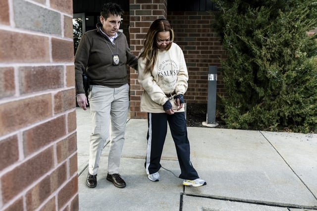 Suspended District Judge Sonya McKnight leaves the Susquehanna Twp. Police department on Thursday, Feb. 15, 2024. The suspended magistrate judge shot her estranged boyfriend in the head as he slept last weekend, police said Thursday in filing attempted murder and aggravated assault charges against her.