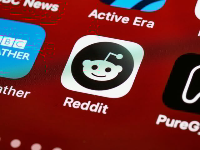 Reddit logo displayed on phone
