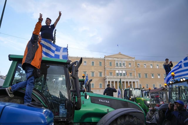 In front of the Greek parliament, protesting farmers rally in Athens, Greece, Tuesday, Feb. 20, 2024. Farmers from around Greece head to the capital in tractor convoys to demand additional financial concessions from the government to cope with the cost of living crisis.