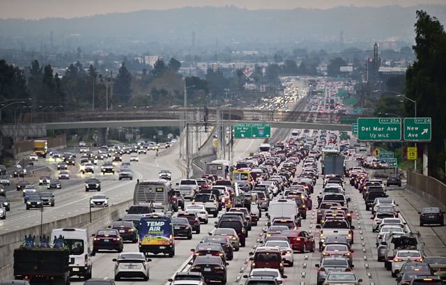 Traffic on a Los Angeles freeway during the evening rush hour commute on April 12, 2023 in Alhambra, California. - US President Joe Biden's administration unveiled new proposed auto emissions rules, aiming to accelerate the electric vehicle transition with a target of two-thirds of the new US car market by 2032. (Photo by Frederic J. BROWN / AFP) (Photo by FREDERIC J. BROWN/AFP via Getty Images)