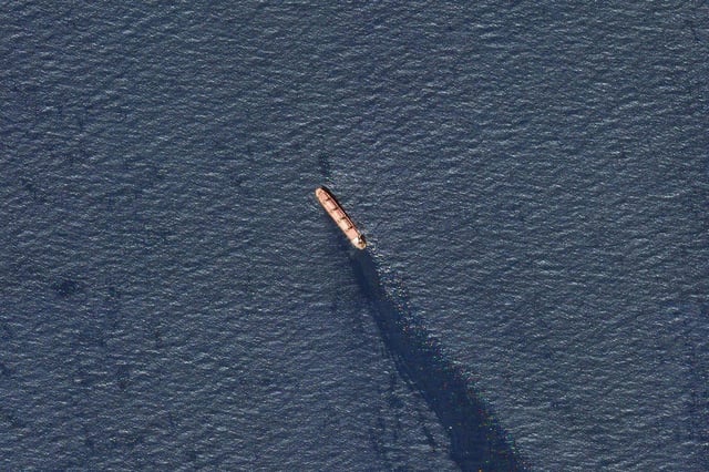In this satellite image provided by Planet Labs, the Belize-flagged bulk carrier Rubymar is seen in the southern Red Sea near the Bay el-Mandeb Strait leaking oil after an attack by Yemen's Houthi rebels on Tuesday, February 20.