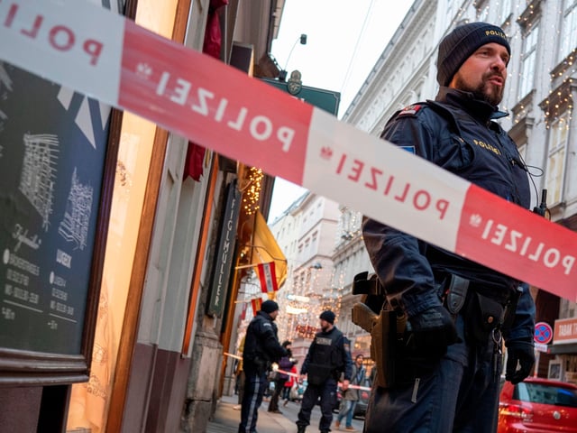 Austrian policemen stand guard at the site of a shooting outside Figlmueller passage in the city center of Vienna, Austria, on December 21, 2018. - One person has died and another has been seriously injured after a shooting in the centre of the Austrian capital Vienna, police said, ruling out a terrorist motive. (Photo by JOE KLAMAR / AFP) (Photo credit should read JOE KLAMAR/AFP via Getty Images)