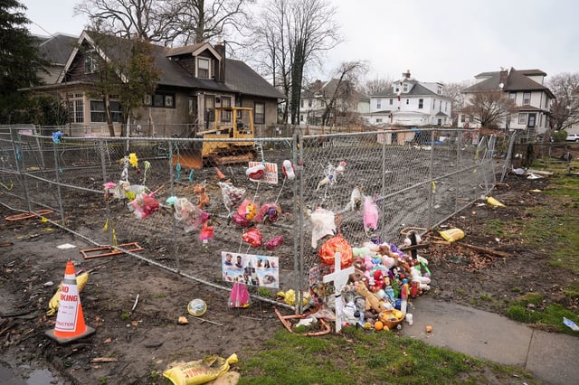 Shown as a makeshift memorial at the scene of a shootout and house fire that killed six members of an extended family in East Lansdowne, Pa., Wednesday, Feb. 28, 2024. (AP Photo/Matt Rourke)
