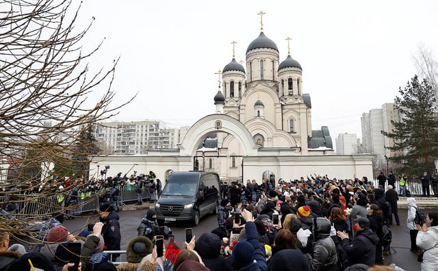 People gather outside a Moscow church ahead of Navalny's funeral amid heavy police presence, March 1, 2024.