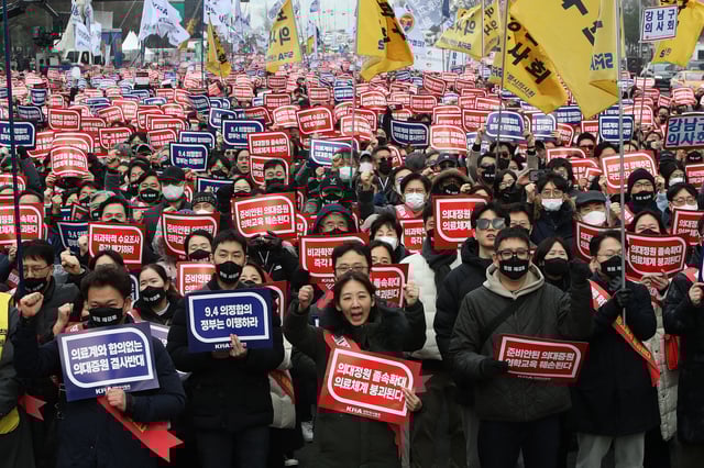 South Korean doctors participate in a rally against the government's medical policy on Sunday in Seoul, South Korea.