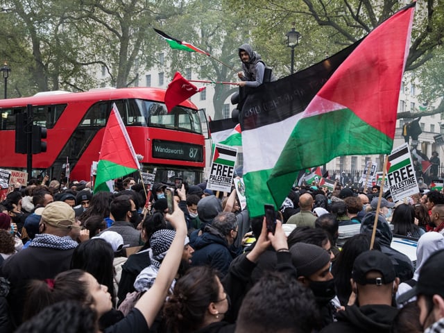 Thousands of people attend an emergency rally in solidarity with the Palestinian people organised outside Downing Street by Palestine Solidarity Campaign, Friends of Al Aqsa, Stop The War Coalition and Palestinian Forum in Britain on 11th May 2021 in London, United Kingdom. The rally took place in protest against Israeli air raids on Gaza, the deployment of Israeli forces against worshippers at the Al-Aqsa mosque during Ramadan and attempts to forcibly displace Palestinian families from the Sheikh Jarrah neighbourhood of East Jerusalem. (photo by Mark Kerrison/In Pictures via Getty Images)