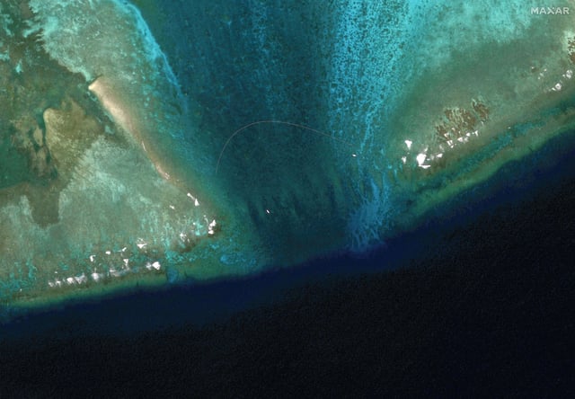 A satellite view of the a floating barrier at the entrance to Scarborough Shoal on February 22, 2024. The Philippines accused China's coast guard of setting up the barrier at the mouth of the disputed fishing ground.