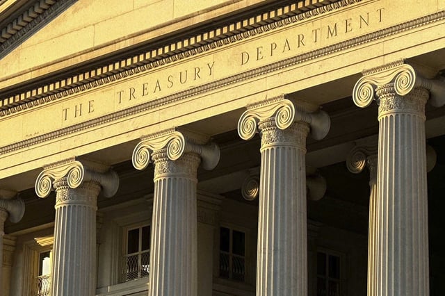 FILE - The Treasury Department is seen near sunset in Washington, Jan. 18, 2023. The Treasury Department says it has sanctioned two individuals and a Greece-based commercial spyware company headed by a former Israeli military officer that developed and distributed technology used to target U.S. government officials, journalists, and policy experts.
