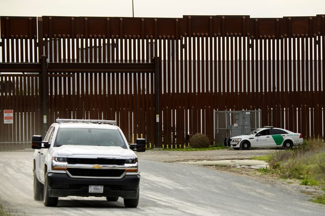 US Border Patrol agents monitor wall