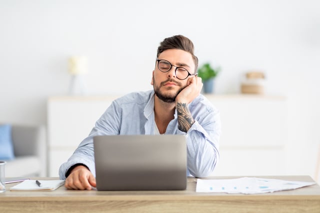 Sleepy man at desk