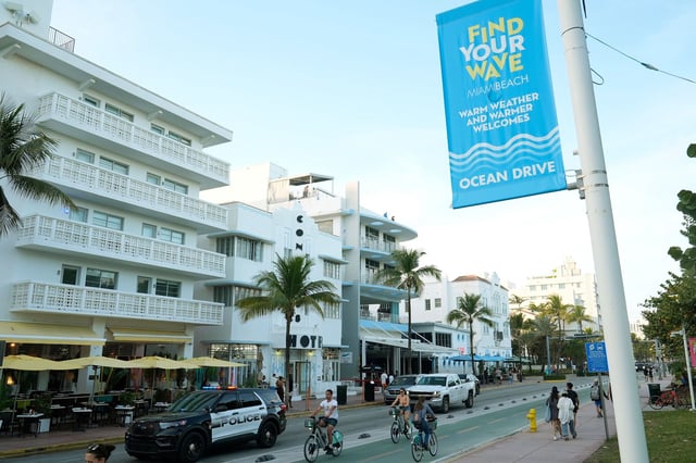 A Miami Beach police car cruises Ocean Drive, Tuesday, Feb. 27, 2024, in Miami Beach, Fla. After three consecutive years of spring break violence, including two fatal shootings last year, Miami Beach officials have announced a series of measures for the month of March that includes parking restrictions for non-residents, closing sidewalk cafes on busy weekends and scanning vehicles with license plate readers. (AP Photo/Marta Lavandier)