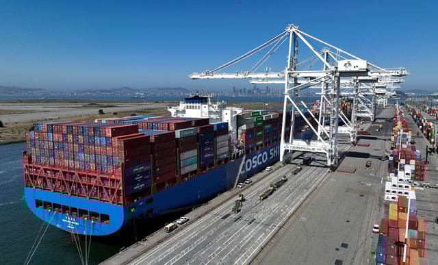 In an aerial view, a container ship sits docked at the Port of Oakland on August 7, 2023, in Oakland, California.