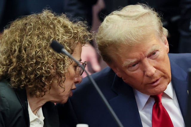Former President Donald Trump talks to attorney Susan Necheles during a pre-trial hearing at Manhattan Criminal Court on February 15, 2024 in New York City.