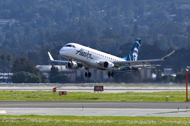 An Alaska Airlines passenger was arrested after allegedly trying to access the cockpit, court documents said.
