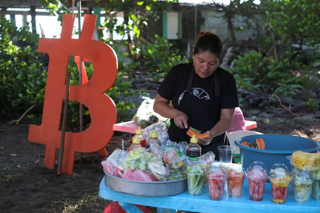 A woman sells fruit in a market during a Bitcoin summit, in Chiltiupan, El Salvador, on Nov. 9, 2023. 