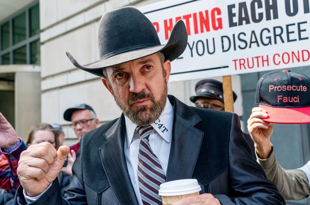 In this 2022 photo, Couy Griffin stands outside the federal court in Washington, DC.