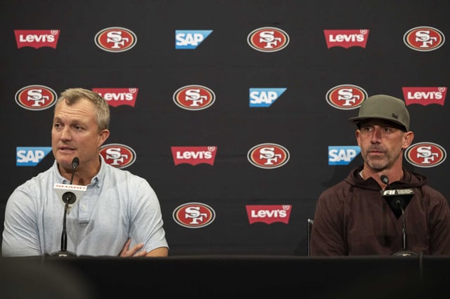 San Francisco 49ers General Manager John Lynch, left, and head coach Kyle Shanahan speak to members of the media as players clear out their lockers following the team’s 25-22 loss to the Kansas City Chiefs in Super Bowl LVIII, in Santa Clara, Calif., Tuesday, Feb. 13, 2024.