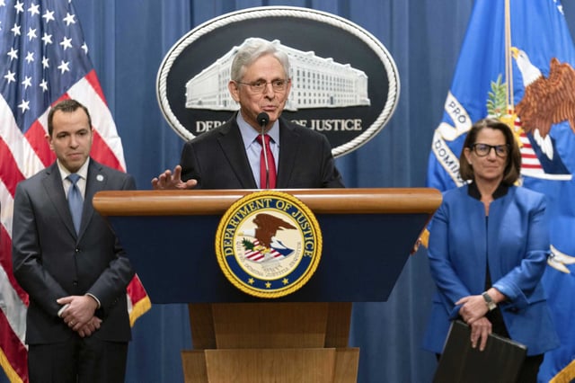 Attorney General Merrick Garland accompanied by New Jersey Attorney General Matthew Platkin and Deputy Attorney General Lisa Monaco, speaks during a news conference at the Department of Justice headquarters in Washington, Thursday, March 21, 2024. The Justice Department on Thursday announced a sweeping antitrust lawsuit against Apple, accusing the tech giant of engineering an illegal monopoly in smartphones that boxes out competitors and stifles innovation.