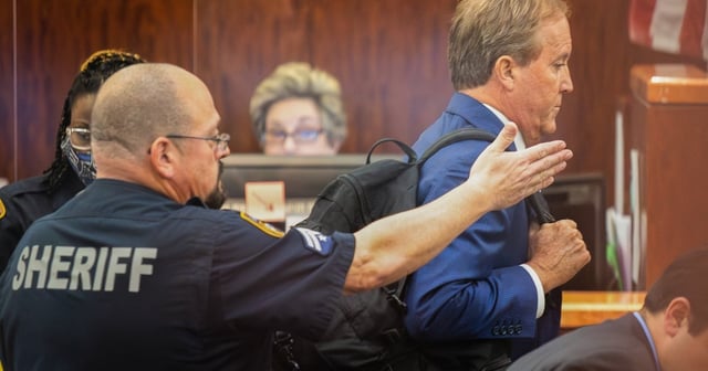 Texas Attorney General Ken Paxton leaves the courtroom after appearing for the eight-year-old felony securities fraud case against him at Harris County Courthouse on Aug. 3, 2023, in Houston.