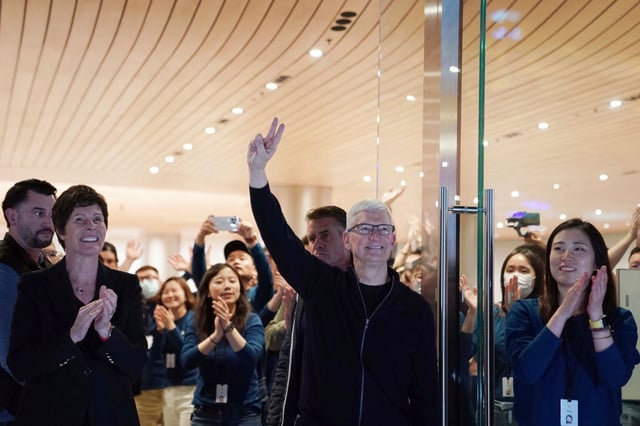 Apple CEO Tim Cook attends the opening of a new flagship Apple store in Shanghai, China on Thursday. Photo: Liu Ying / Xinhua via AP