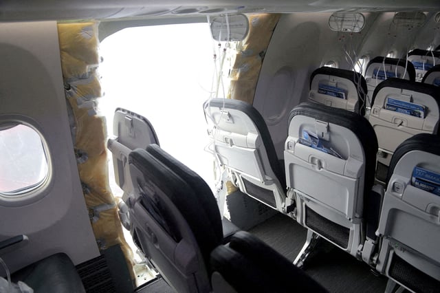 The fuselage plug area of Alaska Airlines Flight 1282 Boeing 737-9 MAX, which was forced to make an emergency landing with a gap in the fuselage, is seen during its investigation by the National Transportation Safety Board (NTSB) in Portland, Oregon, U.S. January 7, 2024.
