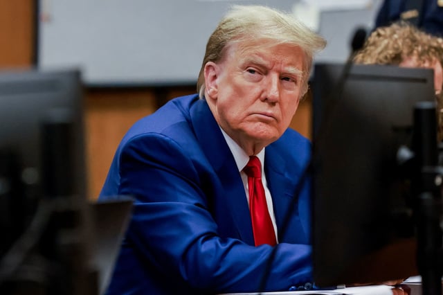 Former US President Donald Trump attends a hearing to determine the date of his trial for allegedly covering up hush money payments linked to extramarital affairs, at Manhattan Criminal Court in New York City on March 25, 2024.