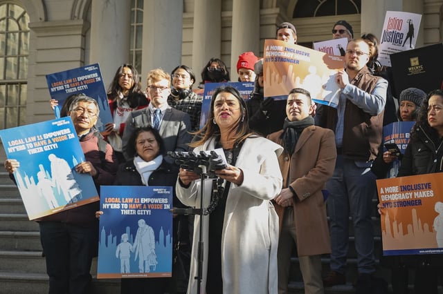 Eva Santos Veloz, center,  is one of the defendant intervenors who would gain voting rights under the local law