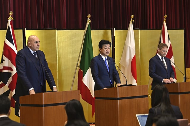 Britain's Defense Minister Grant Shapps, right, Italy's Defense Minister Guido Crosetto, left, and Japanese Defense Minister Minoru Kihara, center, attend a joint press conference after a signing ceremony for Global Combat Air Programme (GCAP) at the defense ministry on Dec. 14, 2023, in Tokyo, Japan. Japan’s Cabinet on Tuesday, March 26, 2024, approved a plan to sell future next-generation fighter jets that it’s developing with Britain and Italy to other countries, in the latest move away from the country’s postwar pacifist principles. (David Mareuil/Pool Photo via AP, File)