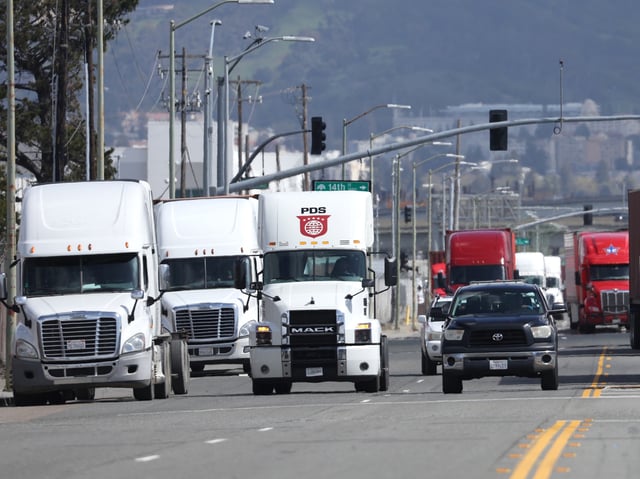 OAKLAND, CALIFORNIA - MARCH 31: Trucks drive through the Port of Oakland on March 31, 2023 in Oakland, California. The U.S. Environmental Protection Agency (EPA) announced that it will allow California's plan to phase out a variety of diesel-powered trucks in the state and require truck manufacturers to sell more zero-emission electric trucks. Half of all heavy trucks sales of heavy truck in California will have to be electric by 2035. (Photo by Justin Sullivan/Getty Images)