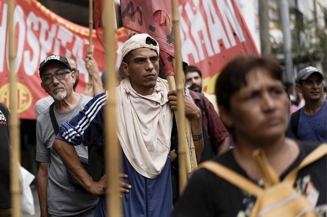 Demonstrators protest food scarcity and economic reforms in Argentina. President Javier Milei devalued the national currency by 50%, but that has not brought inflation under control. 