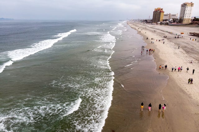 Aerial view of people at the beach in Playas de Rosarito, Baja California State, Mexico, on July 17, 2020.