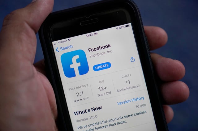 The Facebook app is shown on a smartphone, April 23, 2021. Photo: AP
