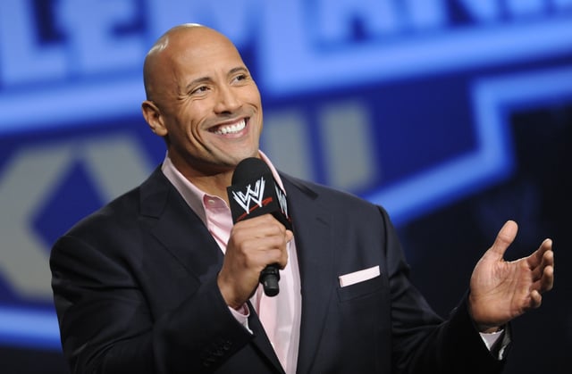 Actor and former WWE Superstar Dwayne "The Rock" Johnson participates in a news conference on Wednesday, Mar. 30, 2011 in New York. As WWE gears up for its biggest annual premium live event in April 2024, the company continues to harness the power of its social media presence to reach its fans. A key component of that strategy is YouTube, where WWE has hit an important milestone: reaching 100 million subscribers. (AP Photo/Evan Agostini, file)