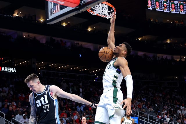 Milwaukee Bucks star Giannis Antetokounmpo dunks against Vit Krejci of the Atlanta Hawks during a game at State Farm Arena last Saturday.