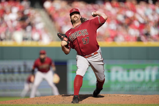 CINCINNATI, OHIO - JULY 22: Andrew Chafin #57 of the Arizona Diamondbacks throws during a baseball game against the Cincinnati Reds at Great American Ball Park on July 22, 2023 in Cincinnati, Ohio.
