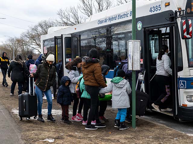 Recently arrived migrants get on a bus outside Floyd Bennett Field shelter on February 21, 2024 in the Brooklyn borough of New York. (Photo by ANGELA WEISS / AFP) (Photo by ANGELA WEISS/AFP via Getty Images)