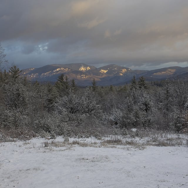 A morning view of Evans Notch covered with fresh snow, December 5, 2021 outside of Stow, Maine. Snowfall is expected to continue over New England into the weekend as an early Spring storm persists.