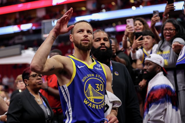 Stephen Curry of the Golden State Warriors waves to the crowd after the game against the Houston Rockets at Toyota Center on April 4, 2024, in Houston.