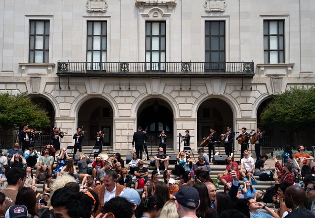 The Mariachi Paredes de Tejastitlán performs "Total Eclipse of the Heart" during the eclipse at the University of Texas in Austin, Tenn., Monday, April 8, 2024.