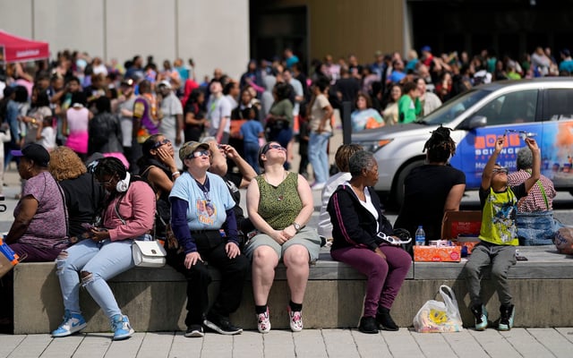 Apr 8, 2024; Columbus, Ohio, USA; COSI guests gather to watch the first total solar eclipse to cross Ohio in more than 200 years at COSIÕs Epic Eclipse Experience event.