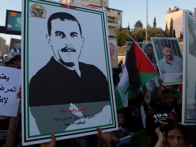 Protesters gather to hold a demonstration demanding the release of Walid Daqqa, a 60-year-old Palestinian prisoner of 37 years who has been diagnosed with cancer, in Bethlehem, West Bank on June 07, 2023. (Photo by Wisam Hashlamoun/Anadolu Agency via Getty Images)