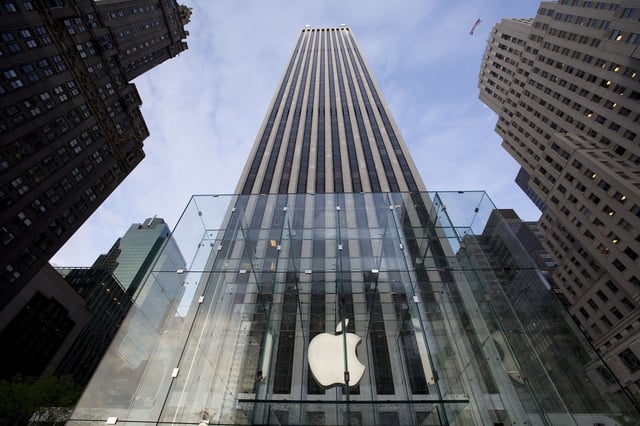 The entrance of Apple's new flagship store on Fifth Avenue and 59th Street in the GM Building during its grand opening. Steve Jobs designed and paid for the $9-million, 32-foot glass cube that serves as a beacon for and entrance into the new store. (Photo by James Leynse/Corbis via Getty Images)