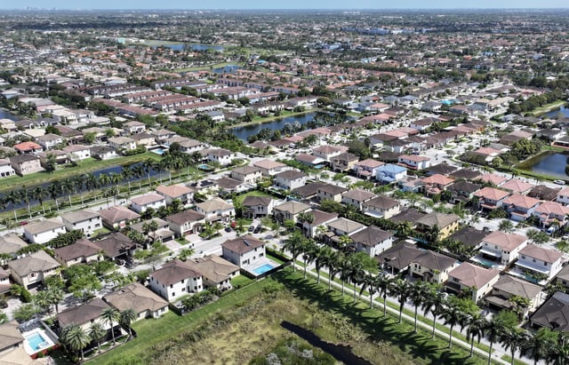 In an aerial view, homes sit on lots in a residential neighborhood on March 15, 2024, in Miami, Florida.
