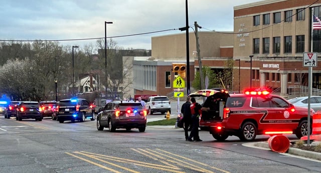 Police respond at West Lafayette High School in Lafayette, Ind., as the school was evacuated on March 26, 2024. Police received a call from someone who claimed to be inside the school with a gun but did not find any credible evidence related to the threats.
