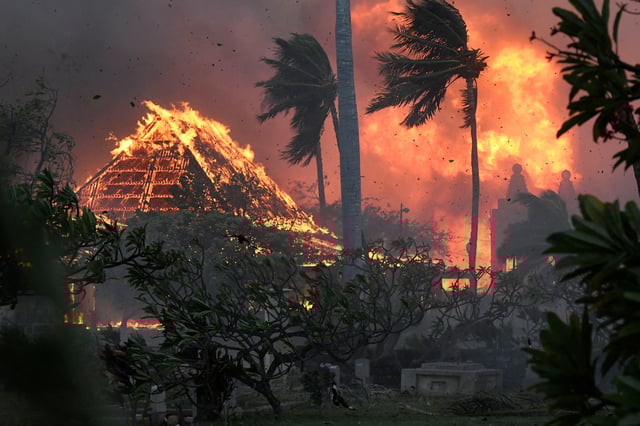 The hall of historic Waiola Church and nearby Lahaina Hongwanji Mission engulfed in flames along Wainee Street on Aug. 8, 2023, in Lahaina, Hawaii. 