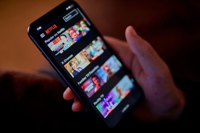 The Netflix app on a smartphone arranged in the Queens borough of New York, US, on Tuesday, March 26, 2024. Netflix Inc. is scheduled to release earnings figures on April 18. Photographer: Gabby Jones/Bloomberg via Getty Images