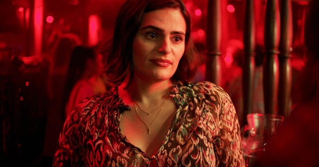 Close-up of Teri, sat in a pub